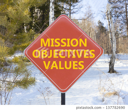 Mission objectives values symbol. Concept words Mission Objectives Values on beautiful red road sign. Beautiful snow forest background. Business mission objectives values concept. Copy space. 137782690