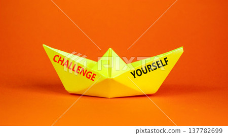 Challenge yourself words symbol. Concept words Challenge yourself on beautiful yellow paper boat. Beautiful orange background. Business lifestyle and Challenge yourself words concept. Copy space. Challenge yourself words symbol. Concept words Challenge yourself on beautiful yellow paper boat. Beautiful orange background. Business lifestyle and Challenge yourself words concept. Copy space. 137782699