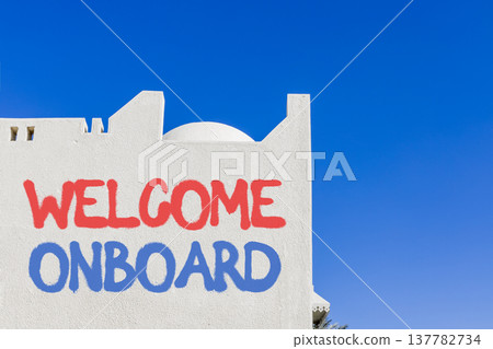 Welcome onboard symbol. Concept words Welcome onboard on beautiful white wall. Beautiful white wall and blue sky background. Business, motivational welcome onboard concept. Copy space. Welcome onboard symbol. Concept words Welcome onboard on beautiful white wall. Beautiful white wall and blue sky background. Business, motivational welcome onboard concept. Copy space. 137782734