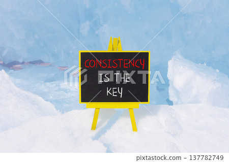 Consistency is the key symbol. Concept words Consistency is the key on beautiful blackboard. Beautiful blue Baikal ice background. Business consistency is the key concept. Copy space. 137782749