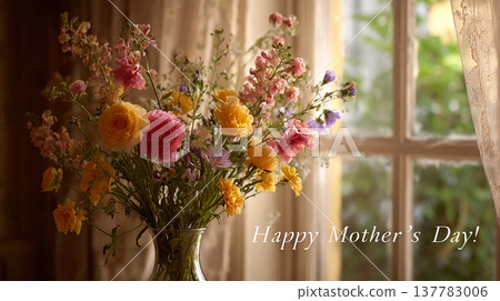 Flowers in a vase near a window on Mother's Day with a message wishing a happy celebration for mothers Flowers in a vase near a window on Mother's Day with a message wishing a happy celebration for mothers 137783006