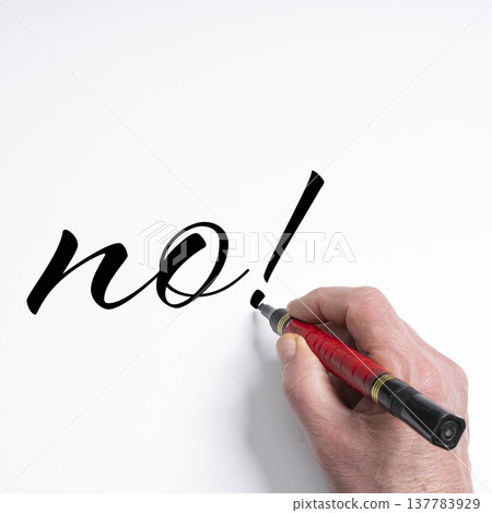 a hand writing the word NO with a marker a hand writing the word NO with a marker 137783929