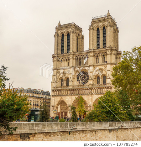 Notre Dame Cathedral with its iconic twin towers, historic Gothic architecture, and rose window in Paris, France Notre Dame Cathedral with its iconic twin towers, historic Gothic architecture, and rose window in Paris, France 137785274