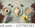 Flat Lay Morning Coffee and Croissant with Yellow Tulips and Lavender on Blue Wood 137785383