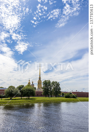 Russia, St. Petersburg, July 3, 2020, Peter and Paul Fortress .. The photo shows the Peter and Paul Fortress on the banks of the Neva against the sky, a view from the arrow of Vasilyevsky Island Russia, St. Petersburg, July 3, 2020, Peter and Paul Fortress .. The photo shows the Peter and Paul Fortress on the banks of the Neva against the sky, a view from the arrow of Vasilyevsky Island 137785613
