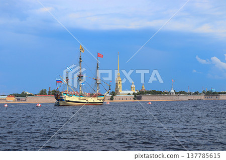 Russia, St. Petersburg, July 19, 2020. Military brig Poltava and the Peter and Paul Fortress in the water area of the Neva during the parade to the Day of the Navy Russia, St. Petersburg, July 19, 2020. Military brig Poltava and the Peter and Paul Fortress in the water area of the Neva during the parade to the Day of the Navy 137785615