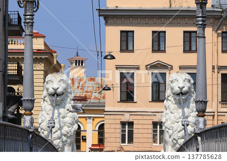 Russia, St. Petersburg, July 1, 2019. Lions on the Lion Bridge. In the photo Lions on the Lion Bridge on the Griboedov Canal, which are architectural landmarks of the city of St. Petersburg Russia, St. Petersburg, July 1, 2019. Lions on the Lion Bridge. In the photo Lions on the Lion Bridge on the Griboedov Canal, which are architectural landmarks of the city of St. Petersburg 137785628
