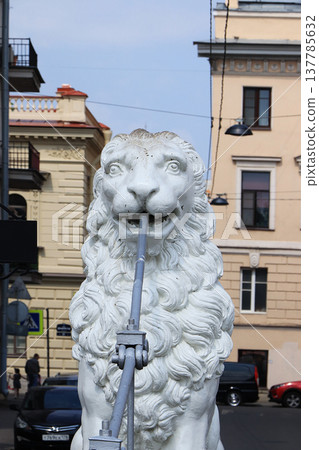 Russia, St. Petersburg, July 1, 2019. Lions on the Lion Bridge. In the photo Lions on the Lion Bridge on the Griboedov Canal, which are architectural landmarks of the city of St. Petersburg Russia, St. Petersburg, July 1, 2019. Lions on the Lion Bridge. In the photo Lions on the Lion Bridge on the Griboedov Canal, which are architectural landmarks of the city of St. Petersburg 137785632