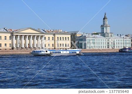 Russia, St. Petersburg, July 8, 2019, Kunstkamera. In the photo there is the Kunstkamera on the banks of the Neva and a boat with tourists, the famous museum of rarities. Russia, St. Petersburg, July 8, 2019, Kunstkamera. In the photo there is the Kunstkamera on the banks of the Neva and a boat with tourists, the famous museum of rarities. 137785640