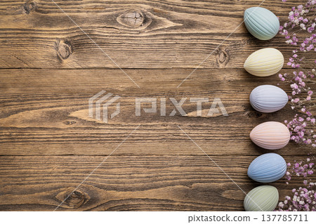 Rustic Easter background with pastel eggs Rustic Easter background with pastel eggs 137785711