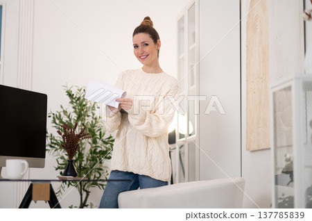 Cute caucasian woman working from home and looking confident 137785839