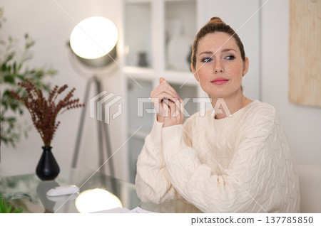 Young woman working from home and looking busy 137785850
