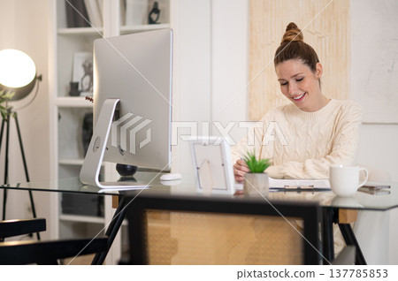 Young woman working from home and looking busy 137785853