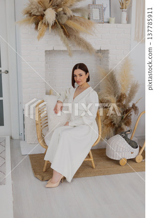 Young beautiful woman posing on a beautiful chair 137785911
