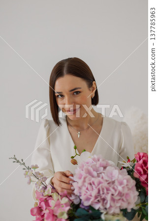Young beautiful woman posing on a beautiful chair Young beautiful woman posing on a beautiful chair 137785963