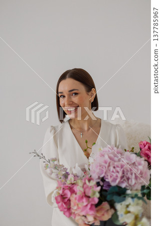 Young beautiful woman posing on a beautiful chair Young beautiful woman posing on a beautiful chair 137785967