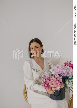 Young beautiful woman posing on a beautiful chair 137785969