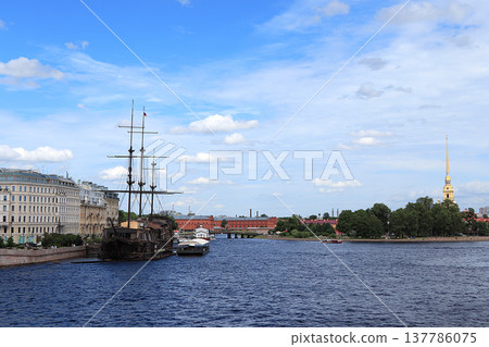 Russia, St. Petersburg, July 3, 2020, Peter and Paul Fortress .. The photo shows the Peter and Paul Fortress and the ship Flying Dutchman, view from the arrow of Vasilyevsky Island Russia, St. Petersburg, July 3, 2020, Peter and Paul Fortress .. The photo shows the Peter and Paul Fortress and the ship Flying Dutchman, view from the arrow of Vasilyevsky Island 137786075