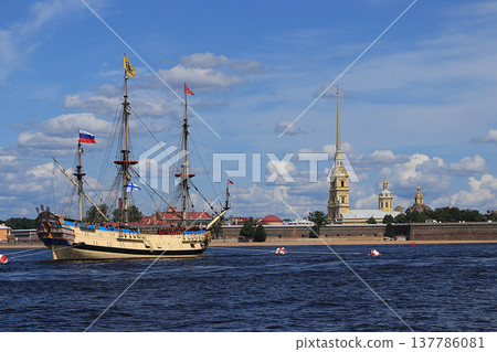 Russia, St. Petersburg, July 21, 2019, Frigate Poltava in the waters of the Neva and the Peter and Paul Fortress, preparing for the parade of the Navy. Russia, St. Petersburg, July 21, 2019, Frigate Poltava in the waters of the Neva and the Peter and Paul Fortress, preparing for the parade of the Navy. 137786081