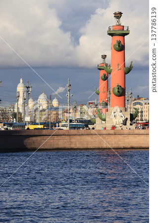 Russia, Petersburg, September 21, 2018. The arrow of the Vasilyevsky Island. On the photo are the Rostral columns on the banks of the Neva against the background of the autumn sky Russia, Petersburg, September 21, 2018. The arrow of the Vasilyevsky Island. On the photo are the Rostral columns on the banks of the Neva against the background of the autumn sky 137786139
