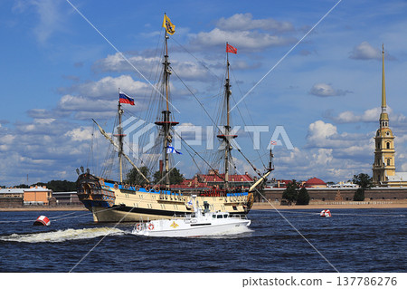 Russia, St. Petersburg, July 21, 2019, Frigate Poltava in the waters of the Neva and the Peter and Paul Fortress, preparing for the parade of the Navy. Russia, St. Petersburg, July 21, 2019, Frigate Poltava in the waters of the Neva and the Peter and Paul Fortress, preparing for the parade of the Navy. 137786276
