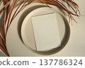 Minimal Blank Card Mockup on Ceramic Plate. Dried Palm Leaves in Sunlight. Beige Table Background. Natural Neutral Branding Template, Elegant Summer Wedding Stationery Scene. Copy Space, Flatlay, top 137786324