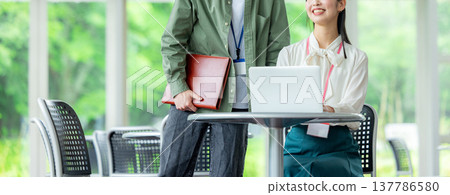 Business woman using a personal computer Business woman using a personal computer 137786580