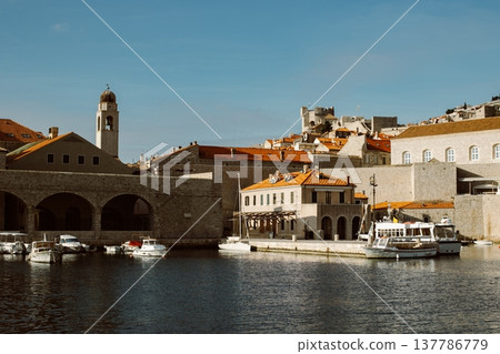 Amazing view of Dubrovnik and the boat in a marina on a sunny day. Amazing view of Dubrovnik and the boat in a marina on a sunny day. 137786779