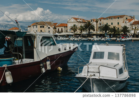Amazing view of yacht marina and old town Supetar, Brach island, Croatia. Beautiful sunny day. Amazing view of yacht marina and old town Supetar, Brach island, Croatia. Beautiful sunny day. 137786898