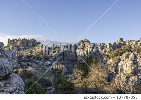 Exploring unique rock formations and landscape at El Torcal in Spain during the daytime with clear blue skies 137787053