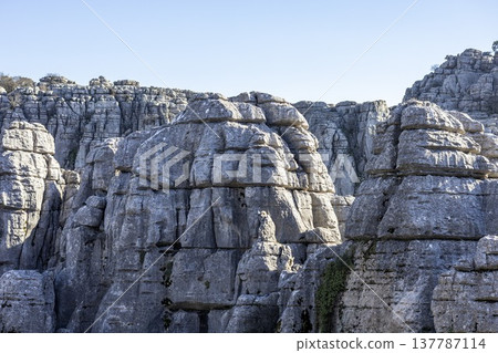 Exploring rock formations at El Torcal in Spain during a clear day 137787114