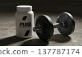 Fuel supplement bottle and heavy dumbbell on gym floor, moody fitness setting. Ideal for protein, gym, strength, sports nutrition, motivation, weight, body, workout 137787174