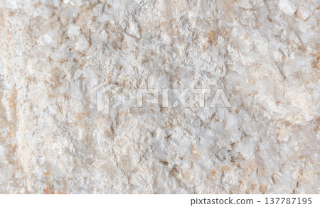 Close-up view of natural white quartz stone surface showcasing intricate textures and patterns, ideal for backgrounds or design elements in various applications Close-up view of natural white quartz stone surface showcasing intricate textures and patterns, ideal for backgrounds or design elements in various applications 137787195