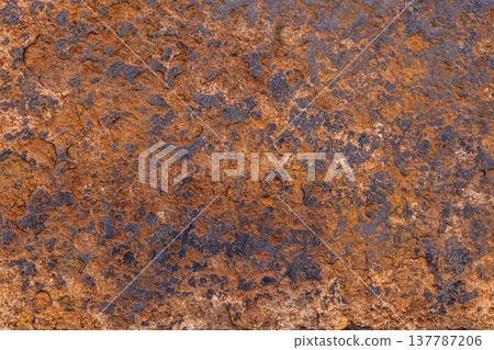 Oxidized steel texture with rust and erosion in natural setting Oxidized steel texture with rust and erosion in natural setting 137787206
