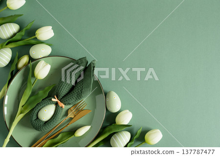 Easter Table Setting with Bunny Napkins and Tulips. Spring Holiday Arrangement Easter Table Setting with Bunny Napkins and Tulips. Spring Holiday Arrangement 137787477