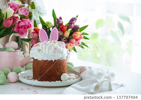 Easter Cake with Bunny Ears and Tulips. Festive Spring Composition 137787484