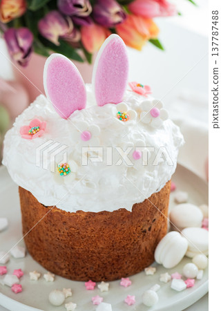 Easter Cake with Bunny Ears and Tulips. Festive Spring Composition 137787488