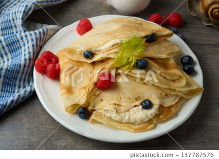 Sweet Crepes with Cream and Fresh Berries Sweet Crepes with Cream and Fresh Berries 137787576