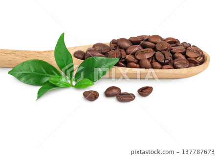 Coffee beans in wooden spoon isolated on a white background 137787673
