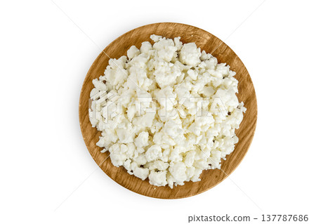 Cottage Cheese, Curd in wooden bowl isolated on white background. Top view. Flat lay 137787686