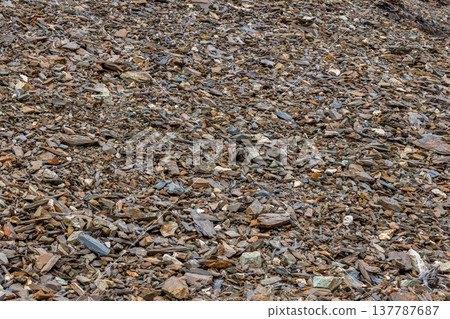 Rugged rocky terrain with colorful stones in daylight 137787687