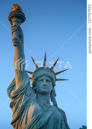 Tokyo, Japan - Oct 13 2024, vertical view of the Tokyo Statue of Liberty on embankment on Odaiba Island, with a blue sky on background, at daytime, Tokyo, Japan Tokyo, Japan - Oct 13 2024, vertical view of the Tokyo Statue of Liberty on embankment on Odaiba Island, with a blue sky on background, at daytime, Tokyo, Japan 137787955