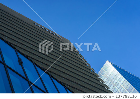 Tokyo, Japan - Okt 02 2024, panoramic view from below of the facade of a multi-storey wide office building in Sony City Osaki, against a blue sky, at daytime, Tokyo, Japan Tokyo, Japan - Okt 02 2024, panoramic view from below of the facade of a multi-storey wide office building in Sony City Osaki, against a blue sky, at daytime, Tokyo, Japan 137788130