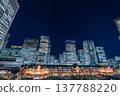 Tokyo Station, surrounded by silver buildings 137788220