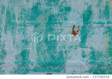 Weathered teal and light blue peeling paint on outdoor wall Weathered teal and light blue peeling paint on outdoor wall 137788358
