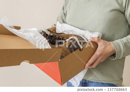 Opening Box With New Leather Boots Opening Box With New Leather Boots 137788663