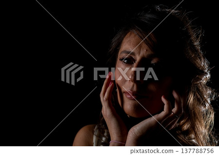 Mysterious woman in quiet contemplation, Enigmatic female figure lost in deep thought, An inscrutable lady in shadows contemplating enigmatic truths concealed within her mind 137788756
