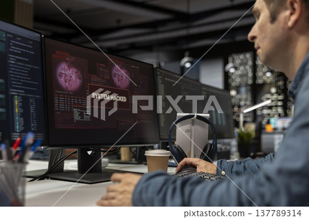 System administrator detecting and blocking hacker intrusion stealing sensitive data. Tech company employee doing incident response against servers network attack from cybercriminals System administrator detecting and blocking hacker intrusion stealing sensitive data. Tech company employee doing incident response against servers network attack from cybercriminals 137789314