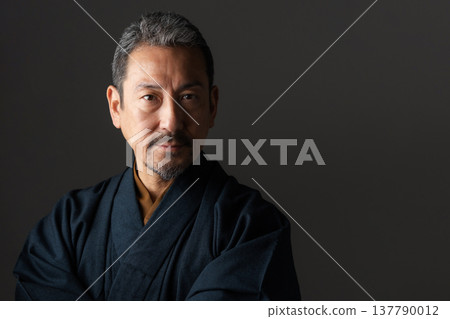 A man wearing a kimono A man wearing a kimono 137790012