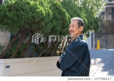 A man wearing a kimono 137790017